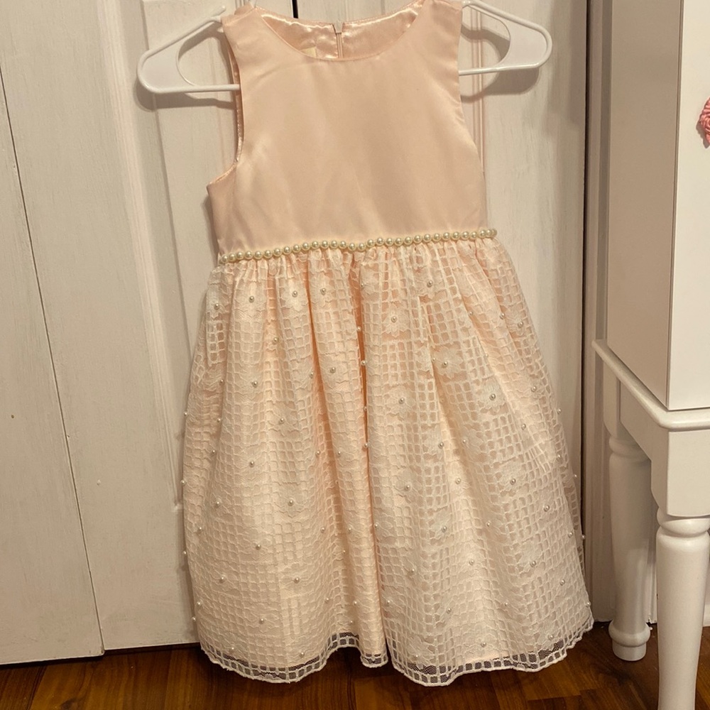 Gorgeous light pink little girls dress with pearl embellishments.
